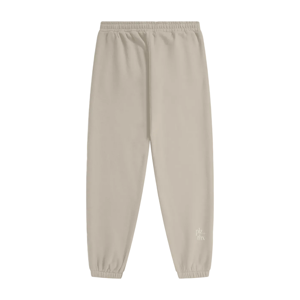 Beige sweatpants with a brand logo on a white background